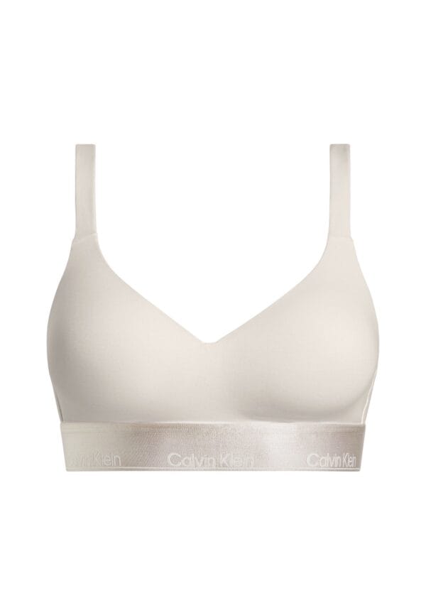 Beige bralette lift -alusasu valkoista taustaa vasten.